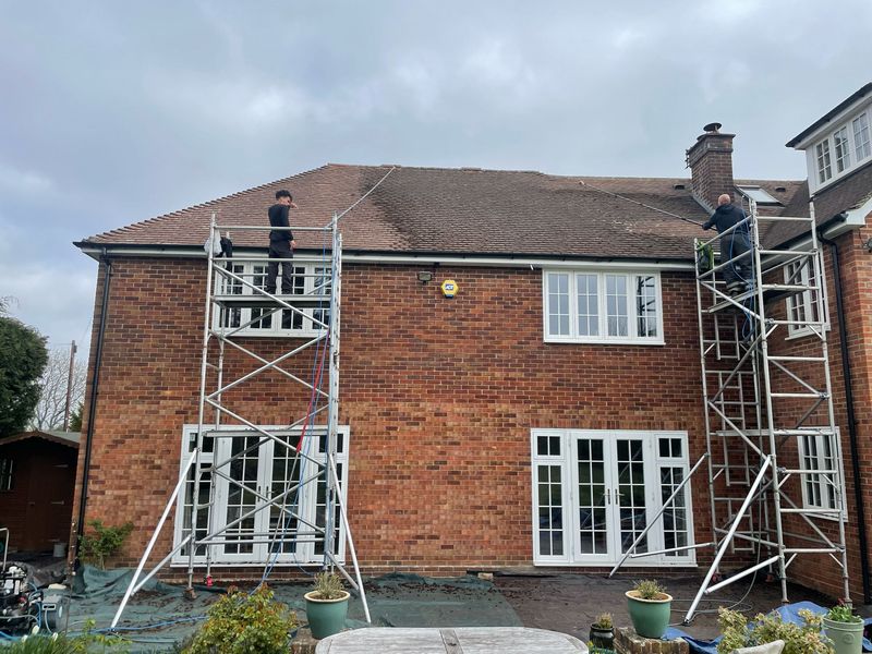 Roof cleaning carried out safely from scaffold towers by The Roof Moss Cleaners in Hilperton